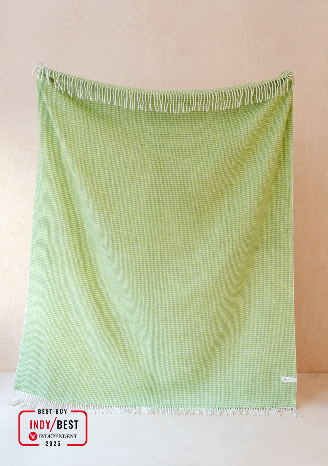 TBCo Recycled Wool Blanket in Green Waffle texture, featuring fringed edges and lime green sustainable wool weave pattern