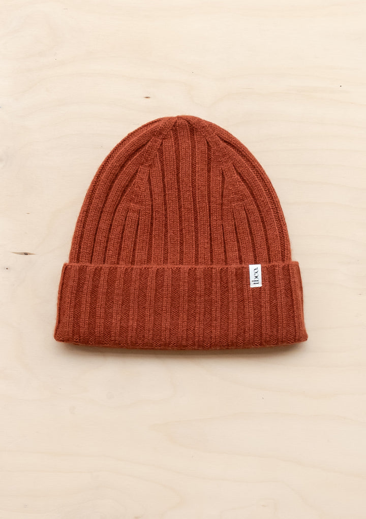 TBCo Cashmere & Merino Beanie in rust colour featuring ribbed texture and folded brim with signature label detail