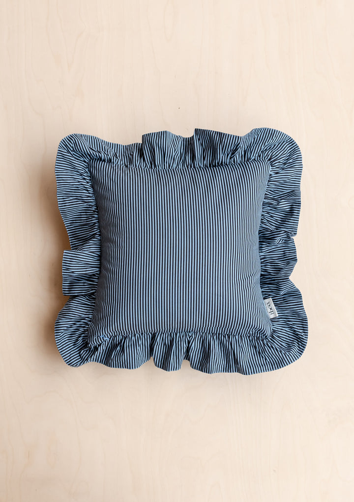 TBCo Cotton Cushion Cover featuring blue and white stripes with ruffled edges, displayed on beige background