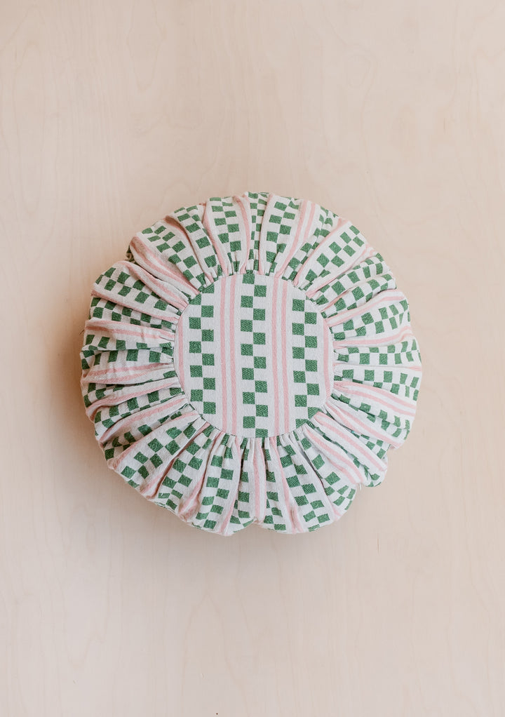 Circular TBCo Cotton Cushion Cover in Green Stripe featuring checkerboard pattern with pink and cream accents on beige background