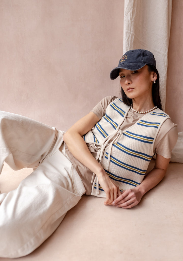 TBCo Recycled Cotton Cap in Sun features floral embroidery detail on blue cotton with adjustable strap for custom fit