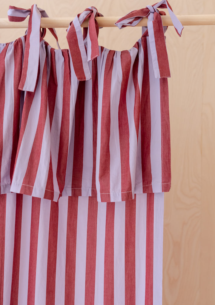 Pair of Cotton Tie-Top Curtains in Lilac Stripe by TBCo, featuring soft cotton fabric with lilac and pink stripes.