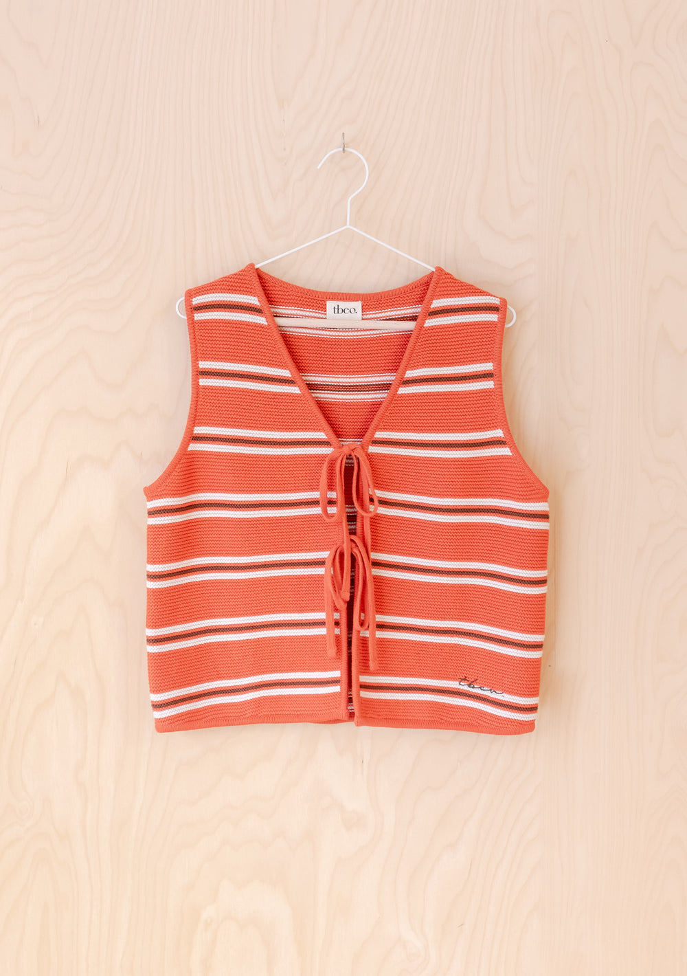 TBCo Cotton Knitted Vest in Tangerine Stripe featuring front ties and classic cream stripes on orange knit background