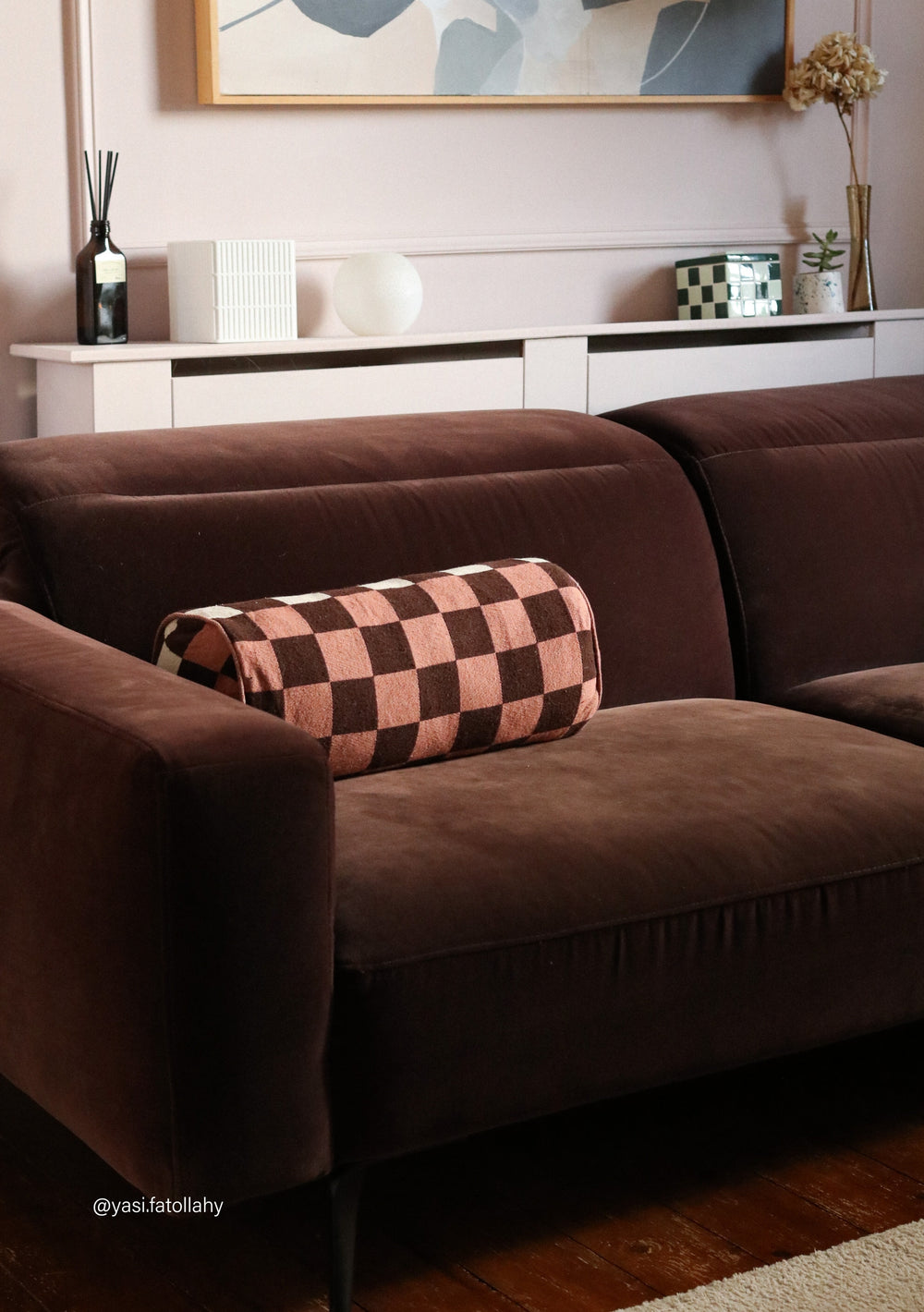 Cotton Cushion Cover in Reversible Bolster Checkerboard by TBCo on brown sofa adding colour and pattern to living room decor