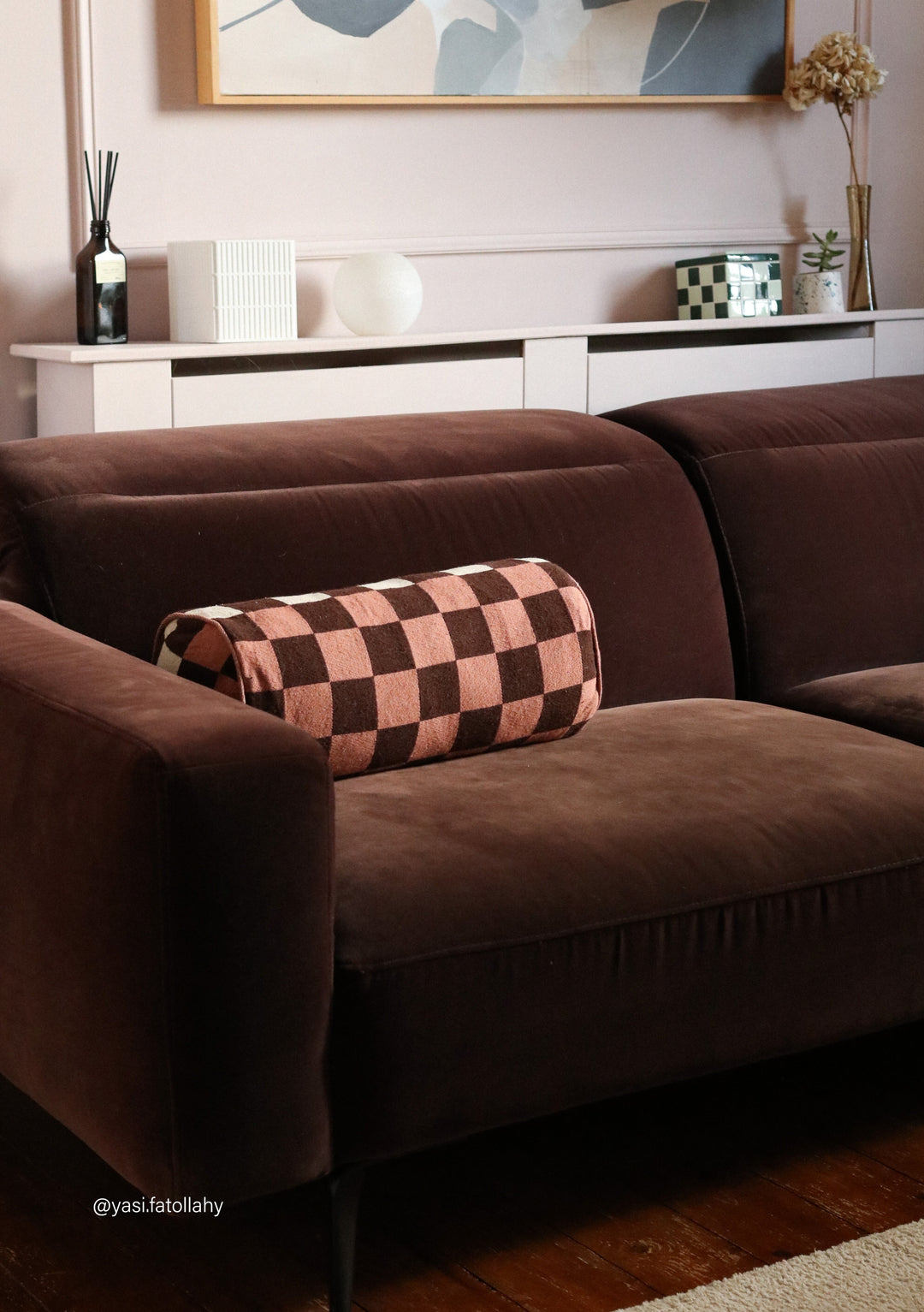 Cotton Cushion Cover in Reversible Bolster Checkerboard by TBCo on brown sofa adding colour and pattern to living room decor