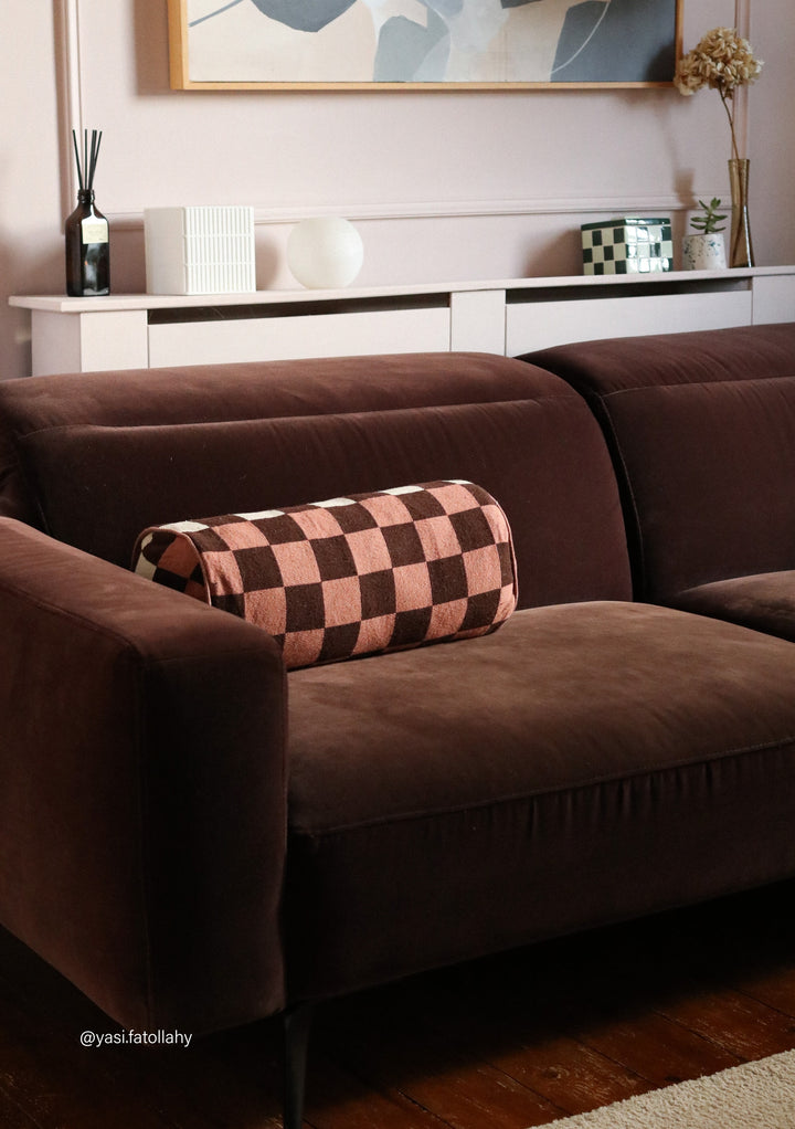 Cotton Cushion Cover in Reversible Bolster Checkerboard by TBCo on brown sofa adding colour and pattern to living room decor