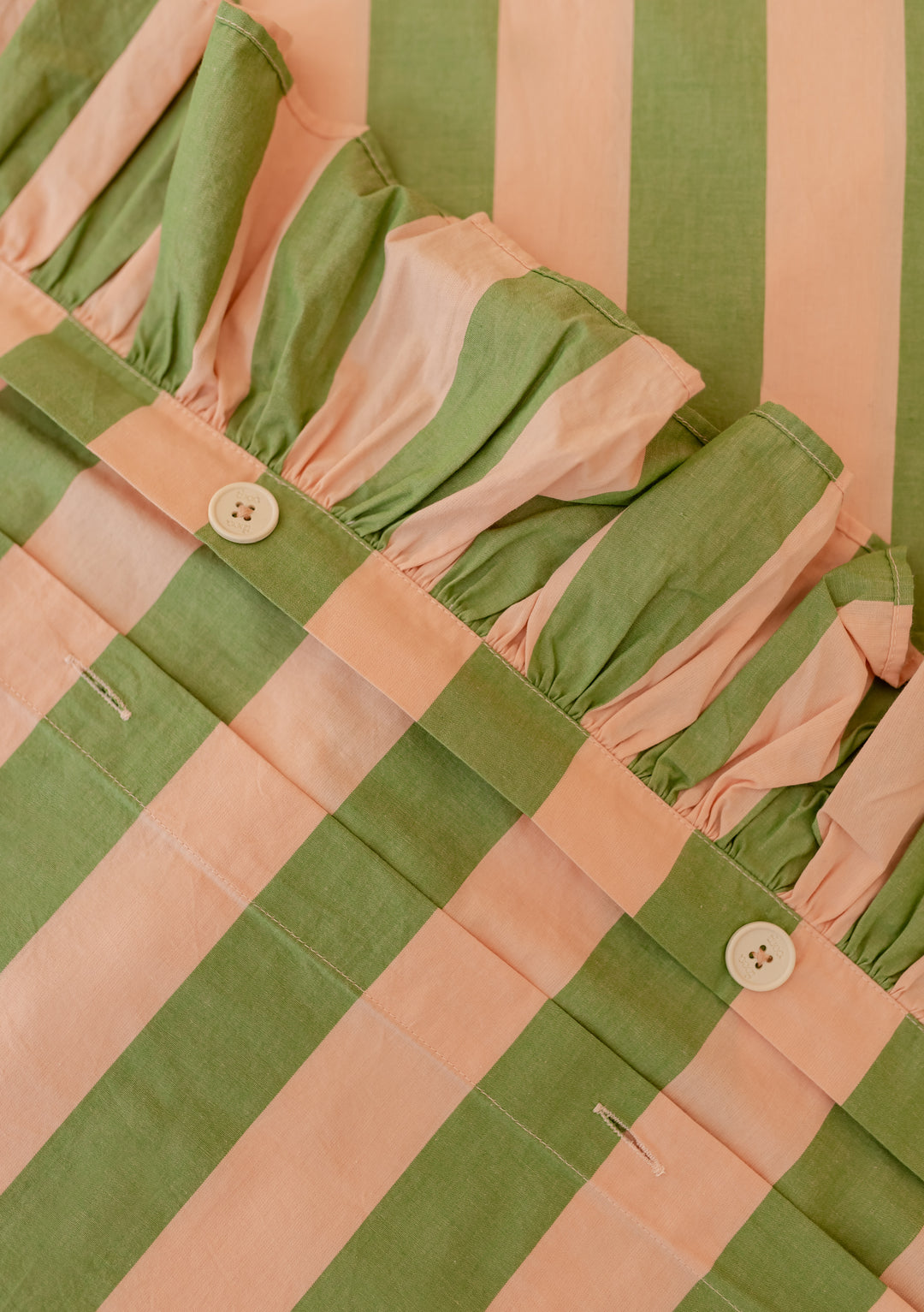 TBCo Cotton Duvet Cover in green and peach stripes with ruffle detail and button closures, displayed on white background