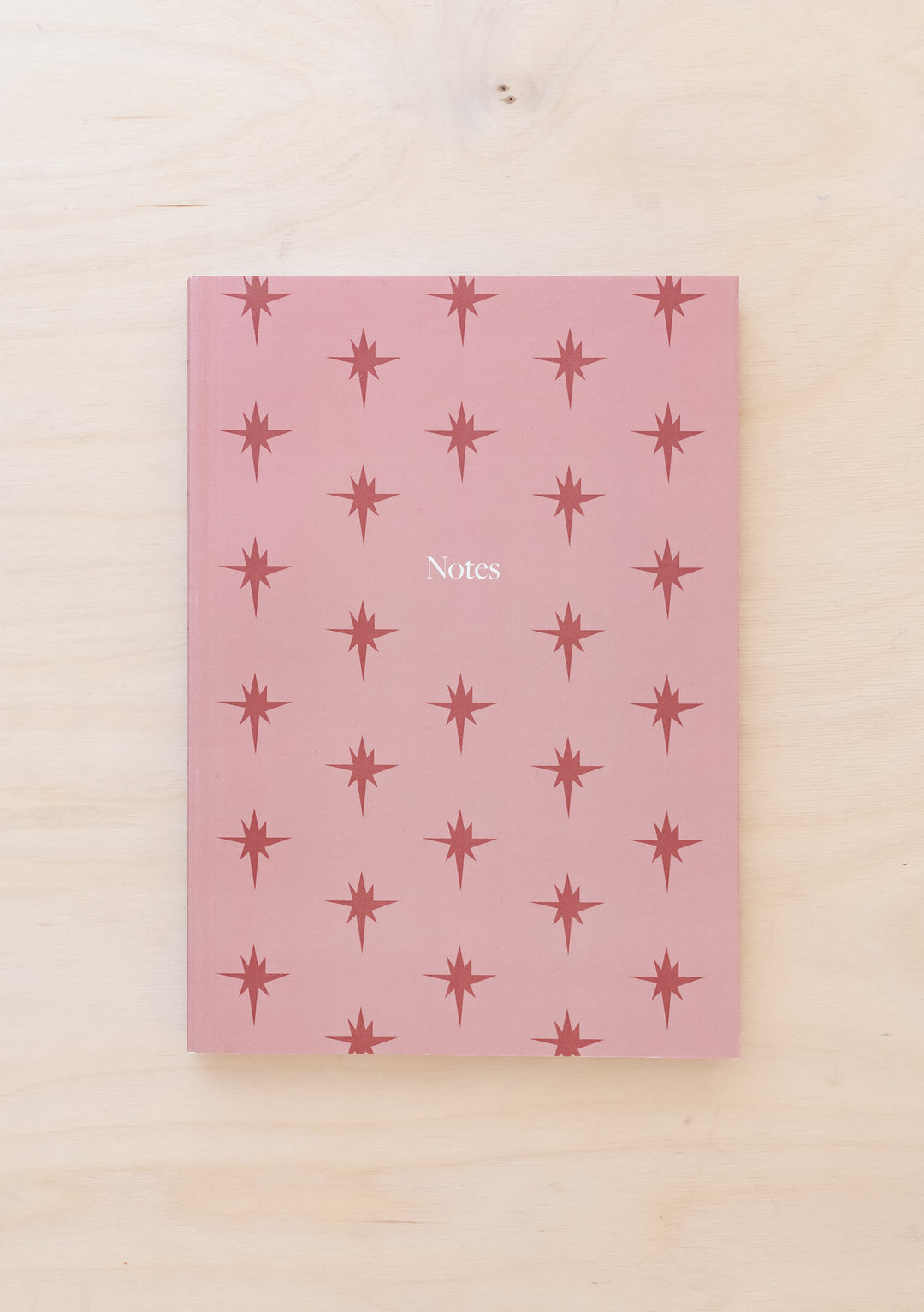 TBCo Pink Celestial Notebook featuring repeating star pattern on textured pink cover with Notes typography