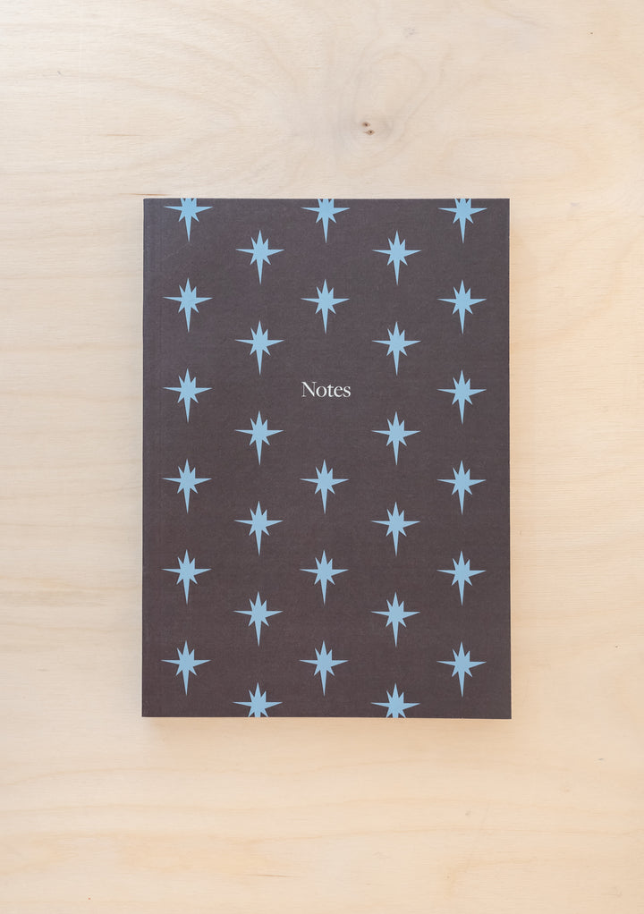 TBCo Blue Celestial Notebook featuring repeating light blue star pattern on grey textured cover with Notes text
