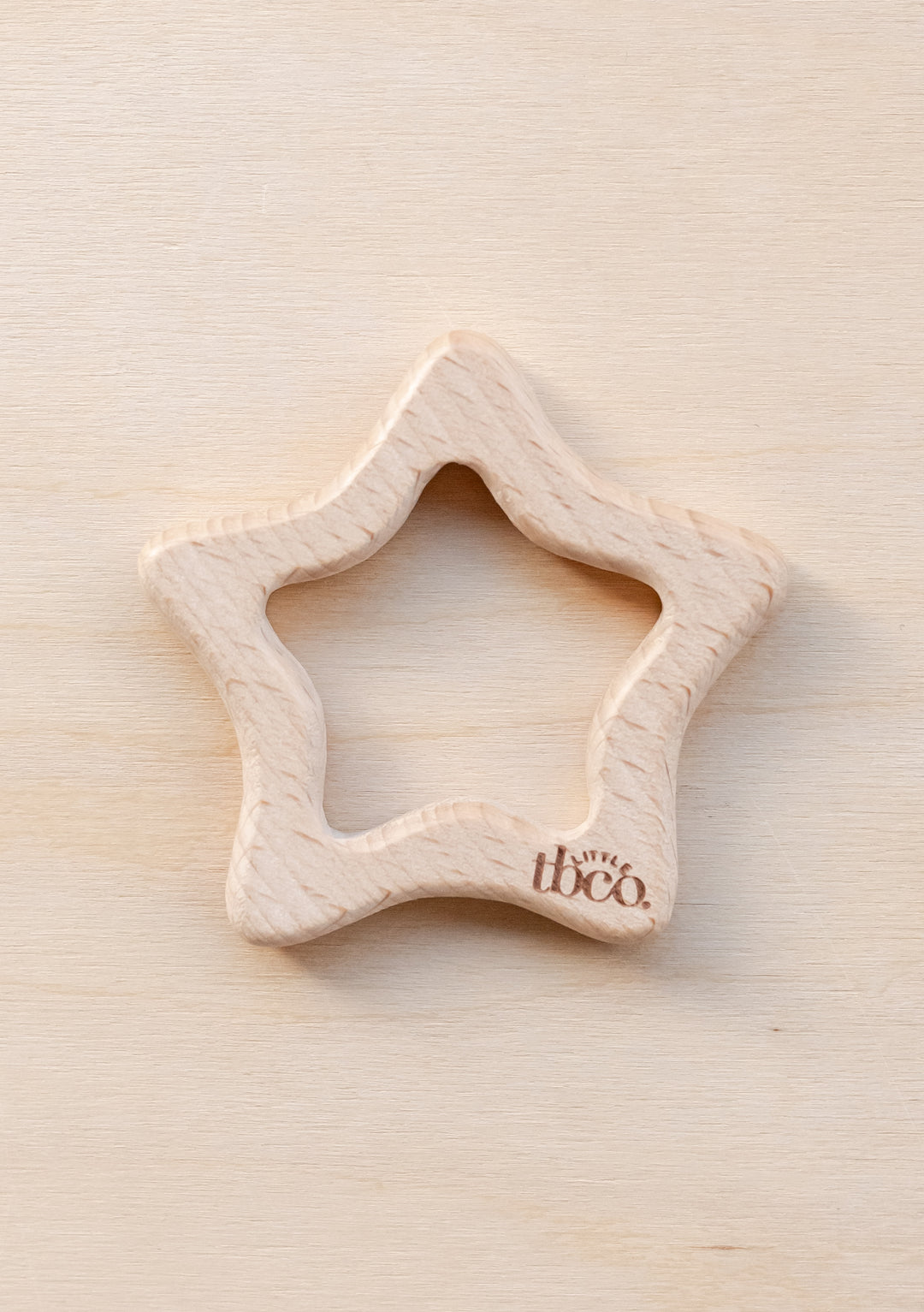 TBCo Organic Wooden Star Teether made from natural beech wood, featuring smooth star shape design for baby teething comfort