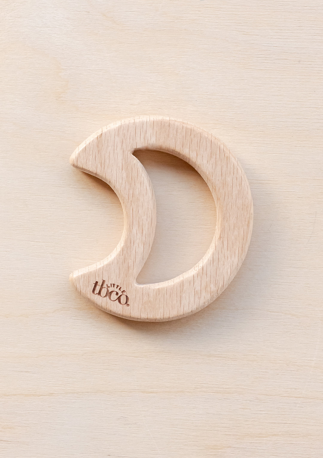 TBCo Organic Wooden Moon Teether featuring natural beech wood in crescent shape for baby's sensory development and teething relief