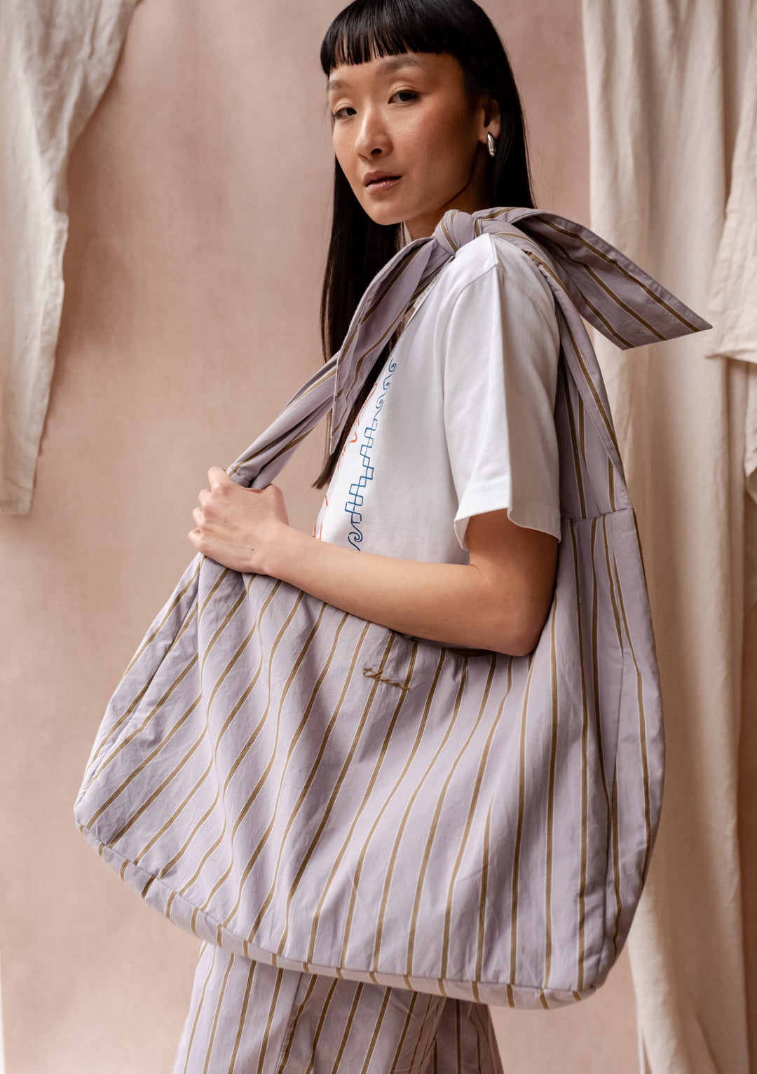 TBCo Large Cotton Multi Knot Bag in lilac stripe pattern, featuring adjustable design and modern striped pattern