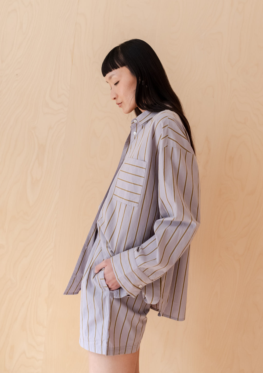 Side view of TBCo Cotton Shorts in Lilac Stripe shown with matching shirt, featuring relaxed fit and olive stripes