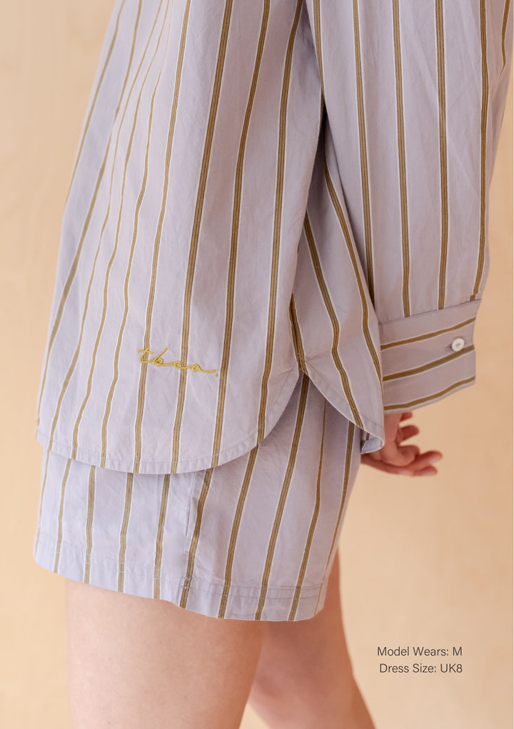 TBCo Cotton Shorts in Lilac Stripe, featuring olive vertical stripes on light lilac cotton fabric, showcasing relaxed fit design