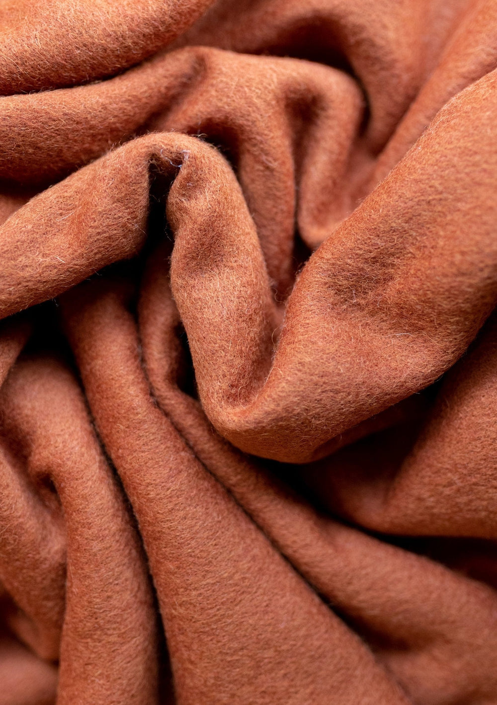 TBCo Lambswool Blanket Scarf in Rust Melange featuring soft, textured folds of premium lambswool in a warm rust colour