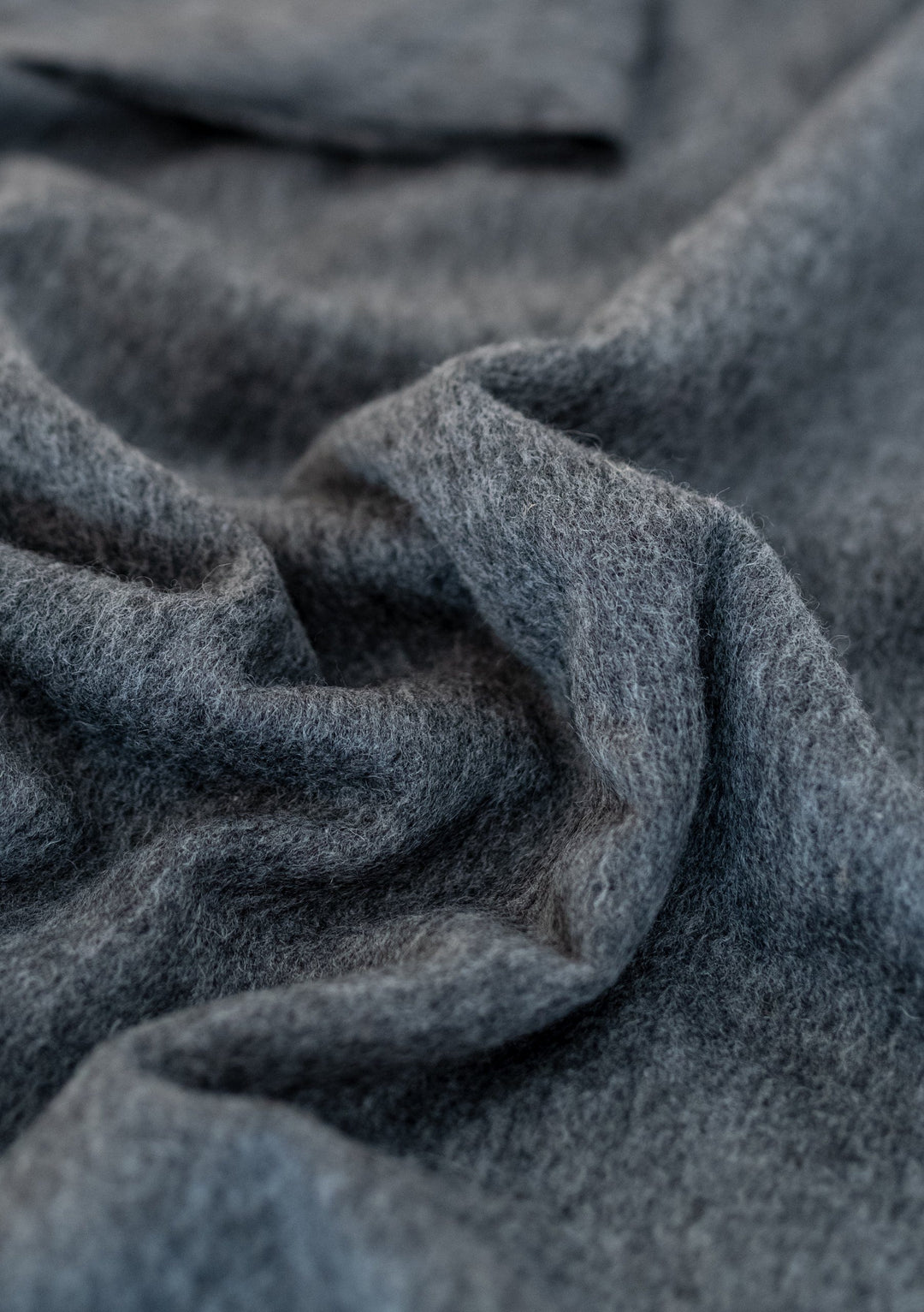 TBCo Lambswool Oversized Scarf in Charcoal Melange shown with soft textured folds highlighting the luxurious wool fabric