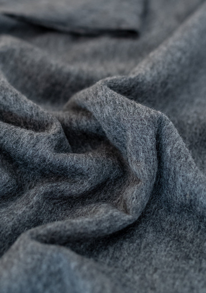 TBCo Lambswool Oversized Scarf in Charcoal Melange shown with soft textured folds highlighting the luxurious wool fabric