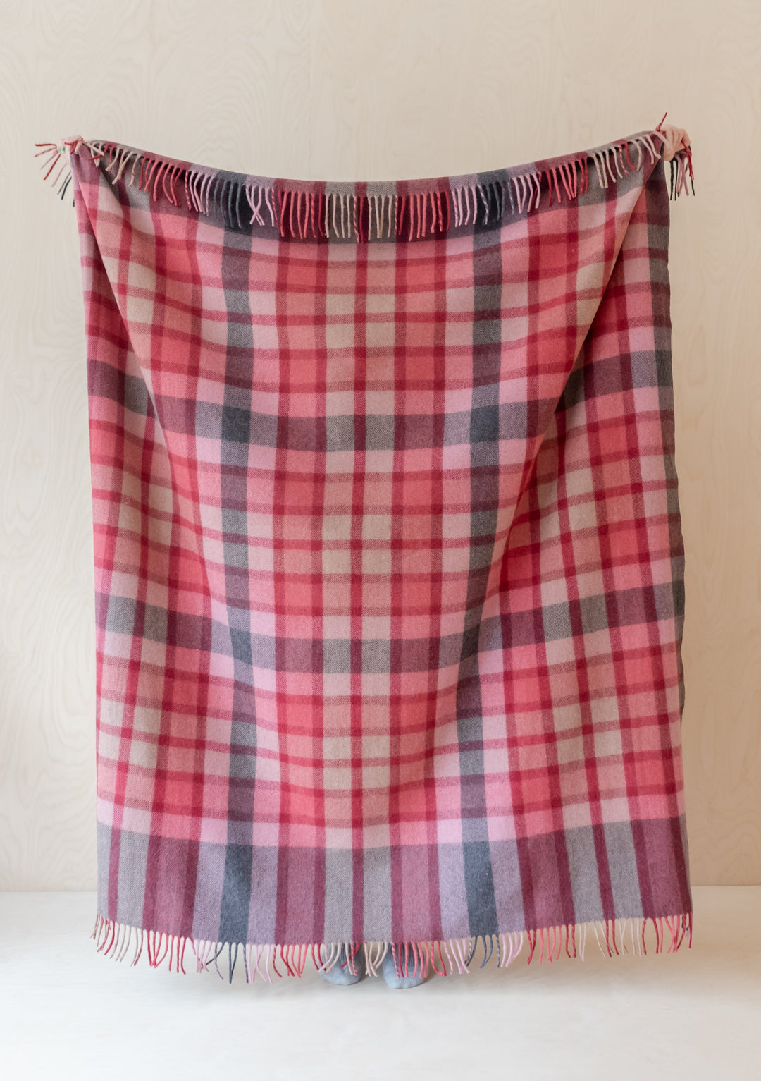 Soft and durable TBCo Recycled Wool Blanket in Berry Gingham Check with fringed edges in pink and grey tones