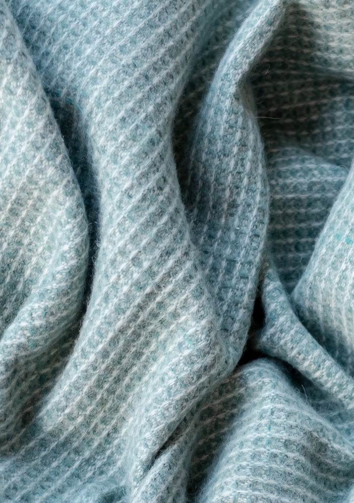 Close-up texture detail of TBCo Recycled Wool Waffle Blanket in Sage showing soft, textured waffle weave pattern