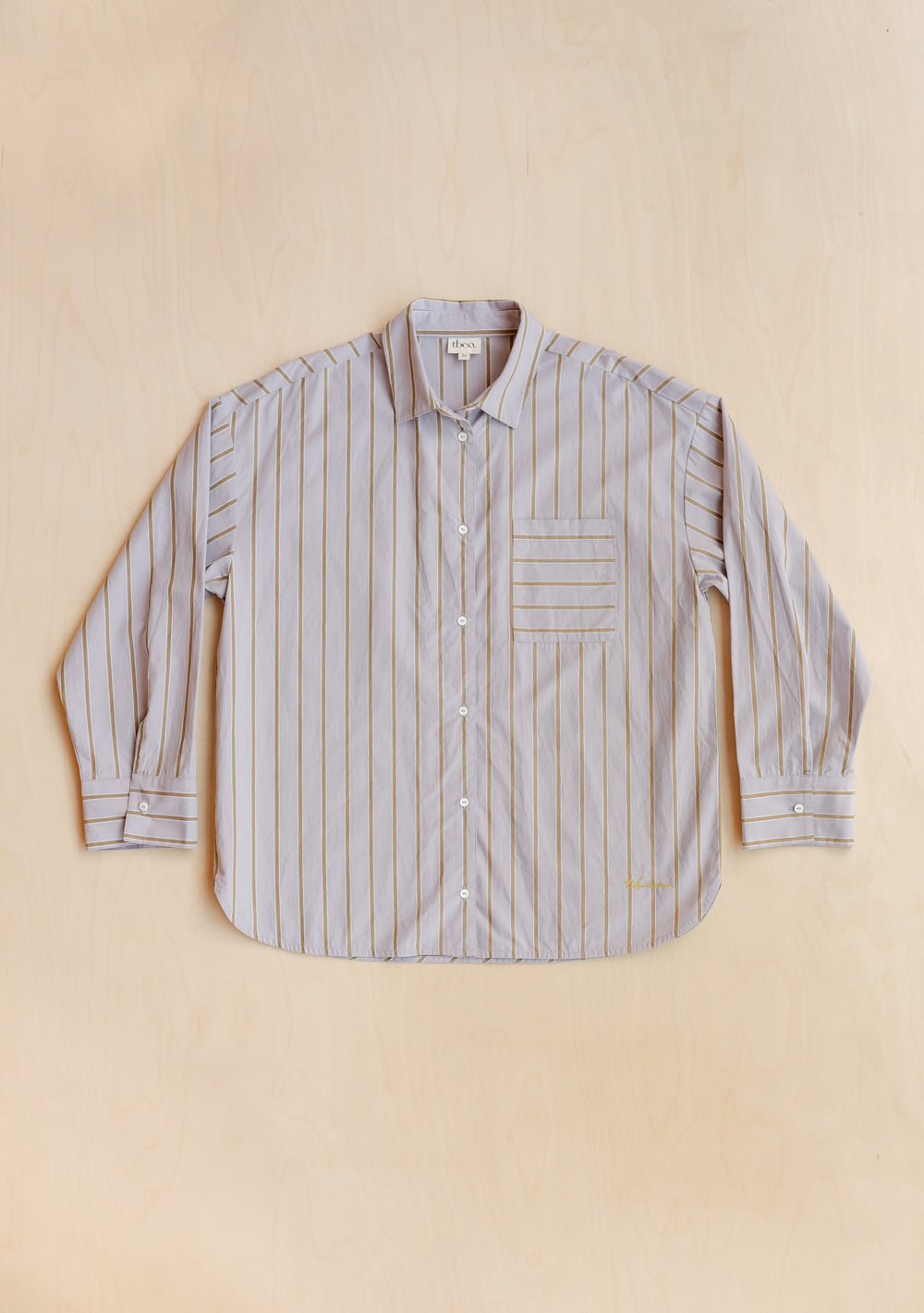 TBCo Cotton Shirt in Lilac Stripe, featuring olive vertical stripes and oversized fit, displayed flat on beige background