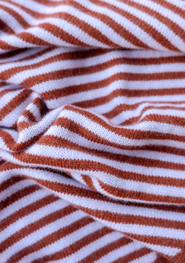 TBCo Merino Triangle Scarf in Lilac Stripe featuring rust and lilac stripes in soft knitted merino wool texture close-up view