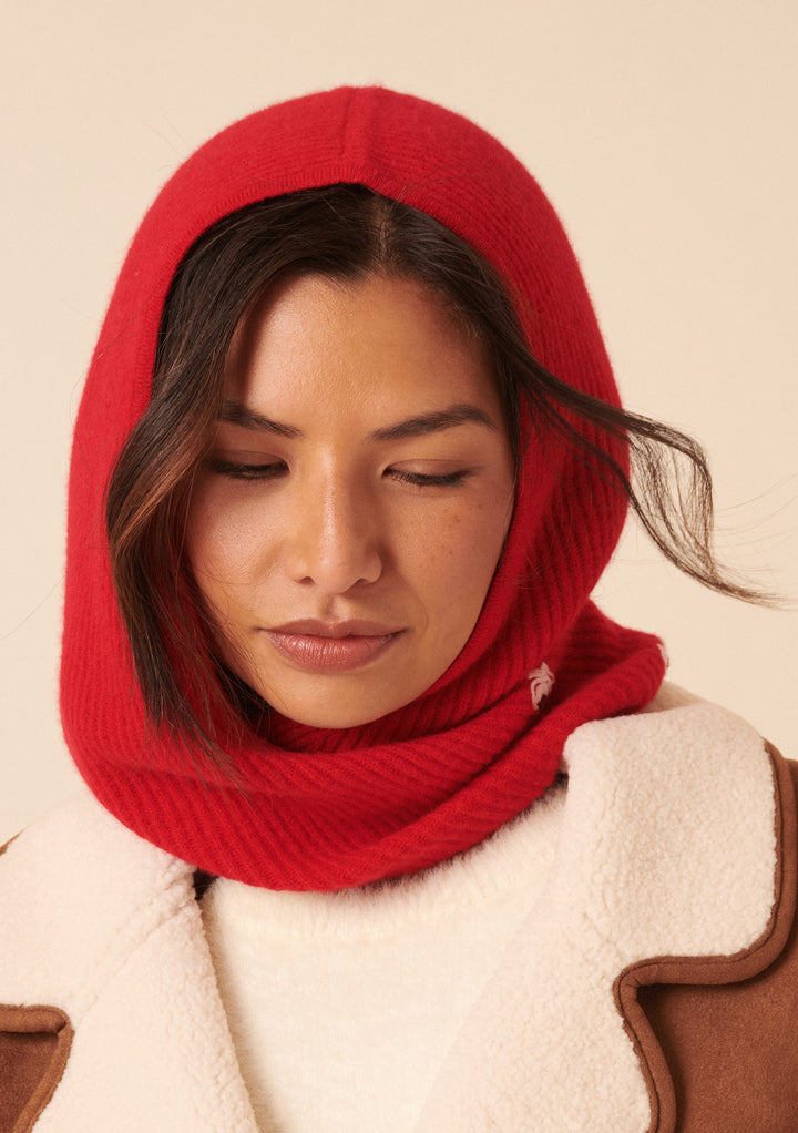 Woman wearing NC x TBCo Red Floral Wool Hood in vibrant red with soft merino wool and floral embroidery by TBCo