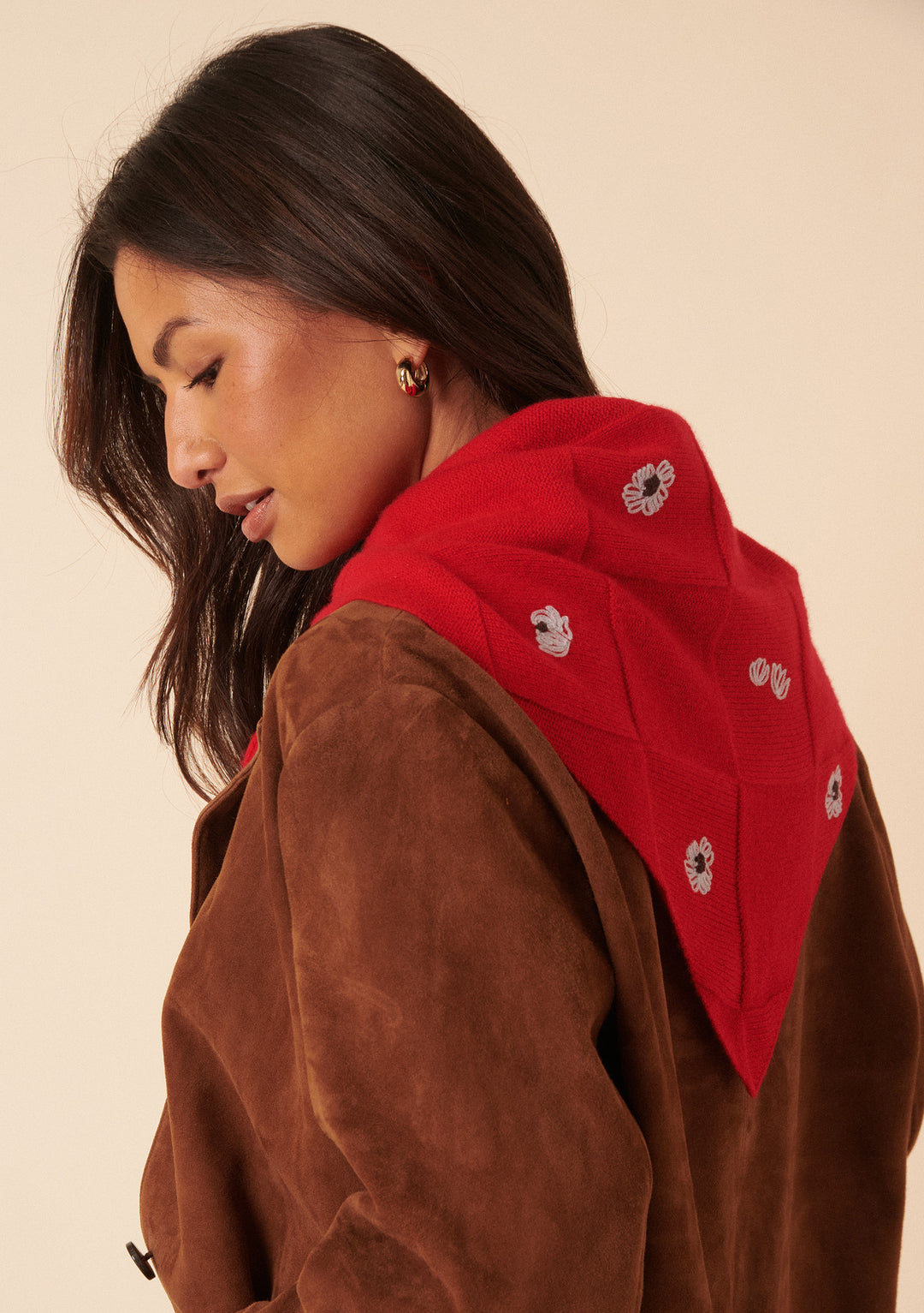 Woman wearing NC x TBCo Red Floral Wool Triangle Scarf with embroidered flowers over brown jacket
