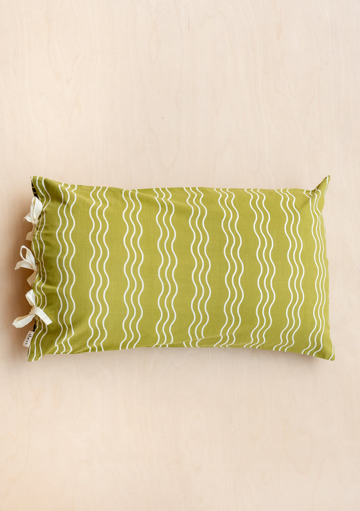 TBCo Cotton Pillowcase in Olive Wave pattern with cream stripes and side tie closures, photographed on beige background