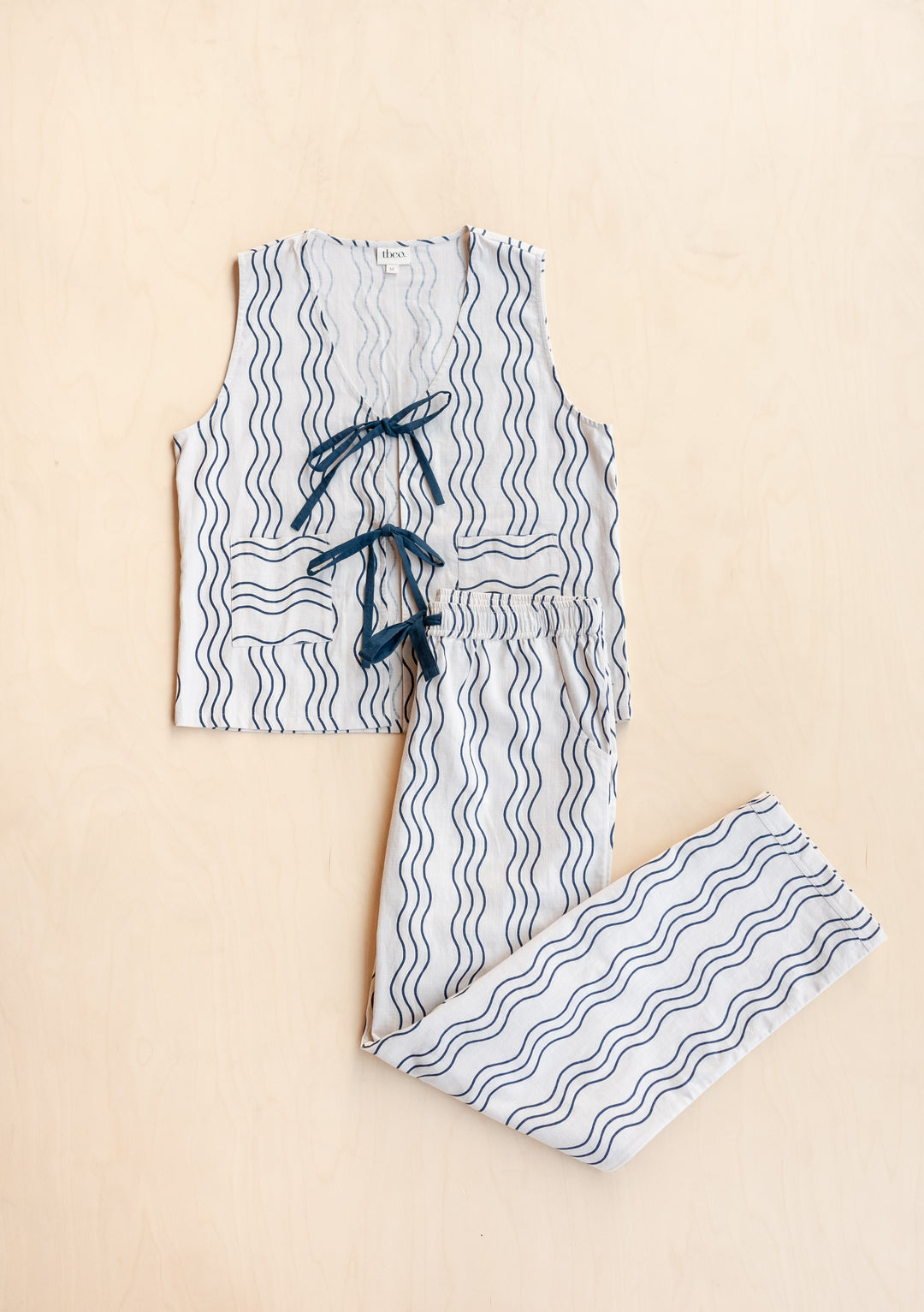 TBCo Cotton Tie Set in Blue Wave pattern, featuring cream and blue two-piece loungewear with wave stripes and adjustable ties