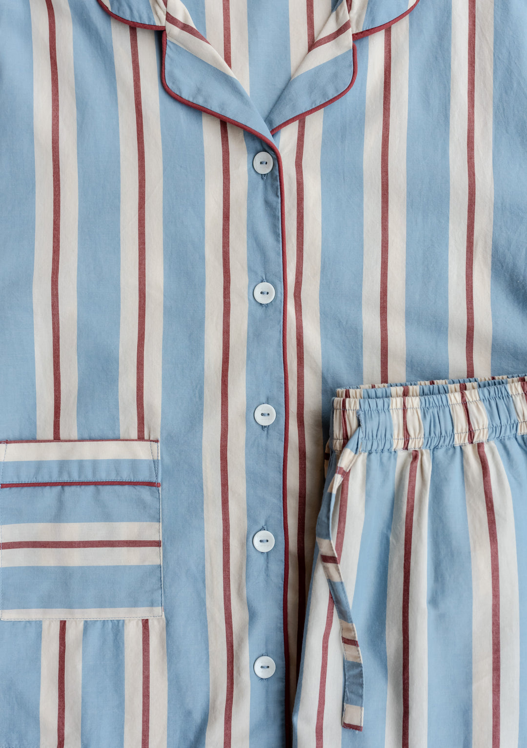 TBCo Cotton Pyjamas in Blue Stripe with red and cream stripes, featuring collared top with piping detail and elasticated waist bottoms