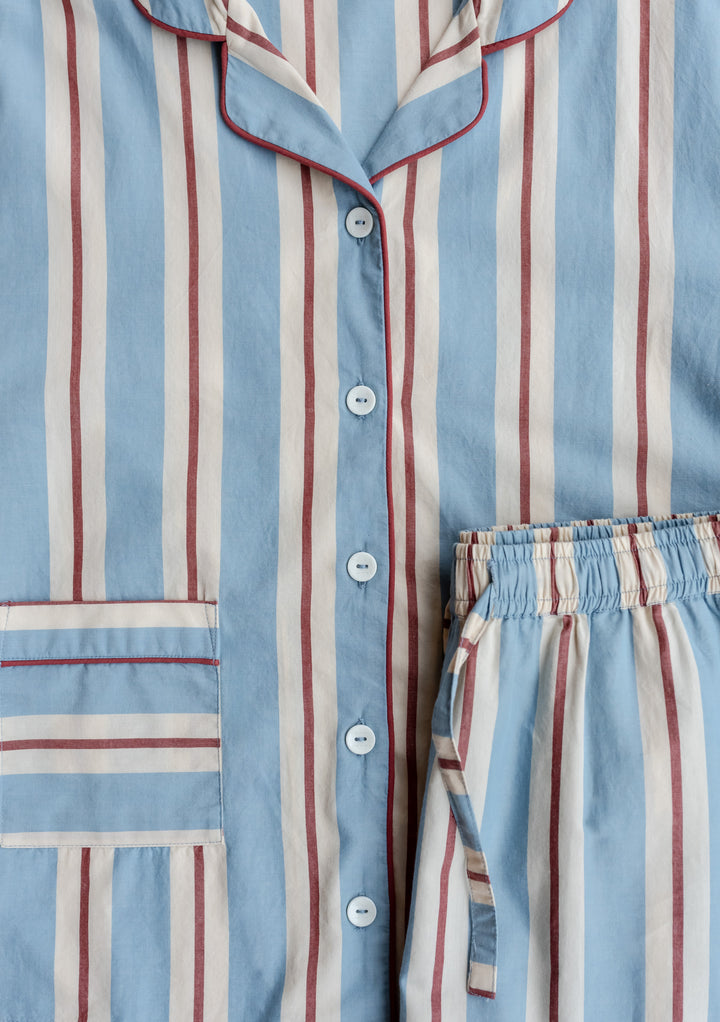 TBCo Cotton Pyjamas in Blue Stripe with red and cream stripes, featuring collared top with piping detail and elasticated waist bottoms