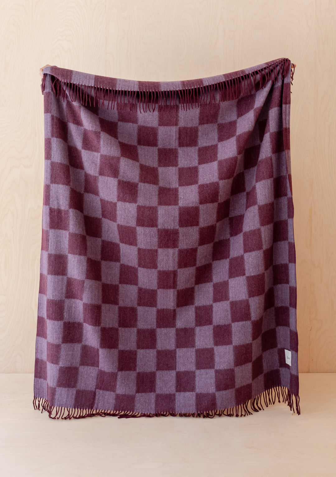 TBCo Recycled Wool Blanket in Burgundy & Lilac Checkerboard with fringed edges, soft and warm for cosy moments.