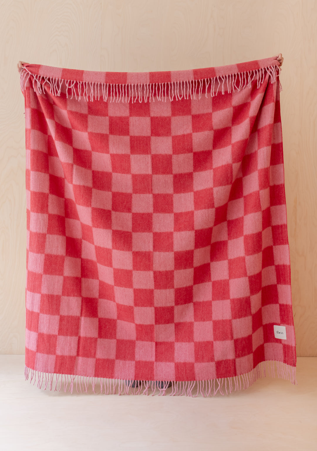 TBCo Recycled Wool Blanket in Pink & Red Checkerboard with fringe, warm and soft for cosy moments at home