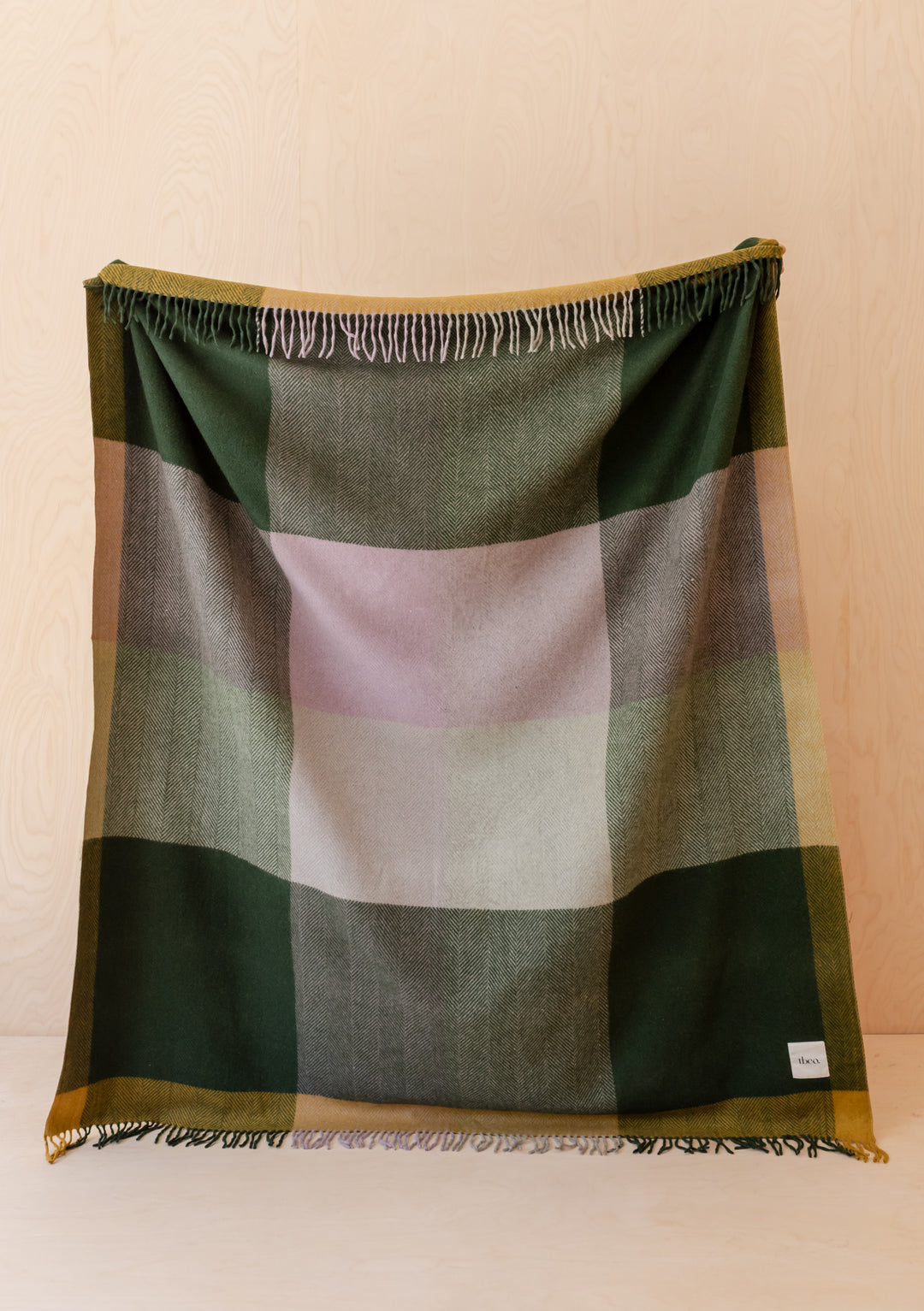 Recycled Wool Blanket in Green Frame Check by TBCo with fringed edges and green lilac mustard check pattern