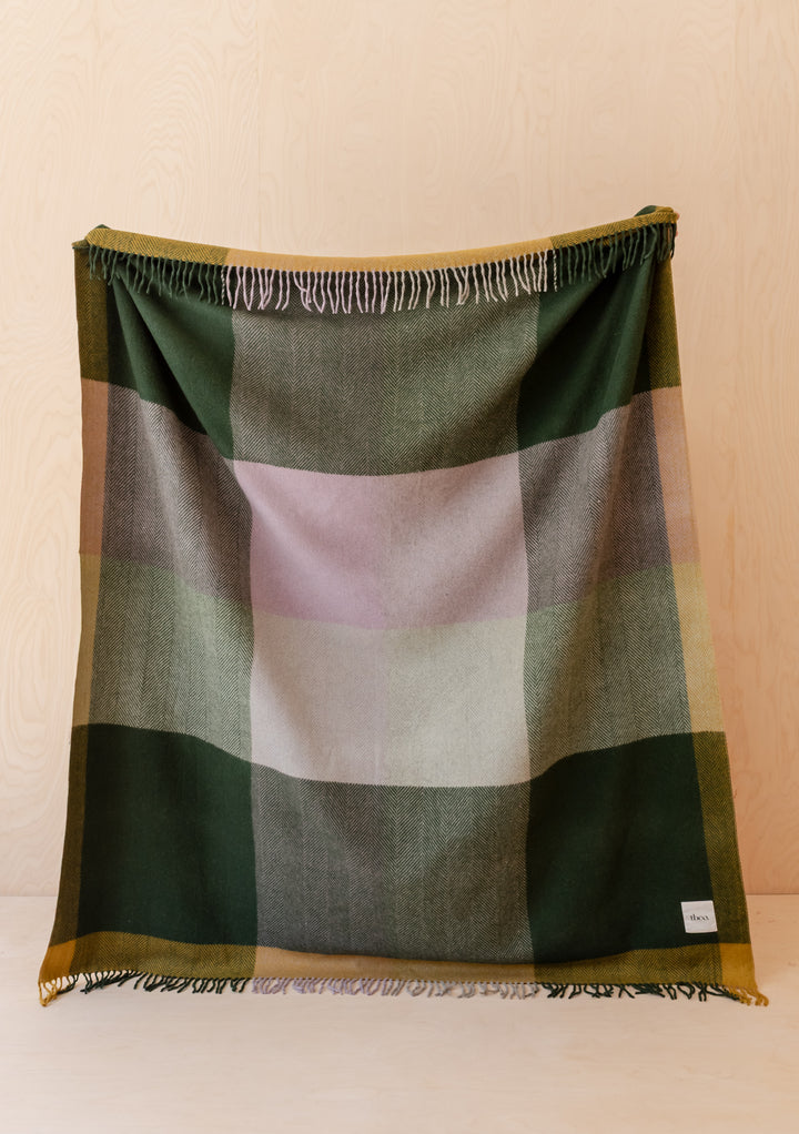 Recycled Wool Blanket in Green Frame Check by TBCo with fringed edges and green lilac mustard check pattern