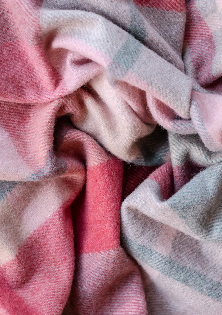 TBCo Recycled Wool Small Picnic Blanket in pink and grey patchwork check pattern, showing soft textured wool fabric detail