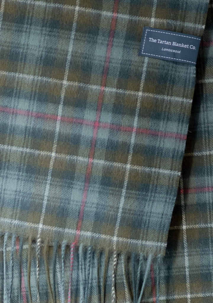 TBCo Men's Lambswool Scarf in Mackenzie Weathered Tartan, featuring soft fringed edges and traditional plaid pattern