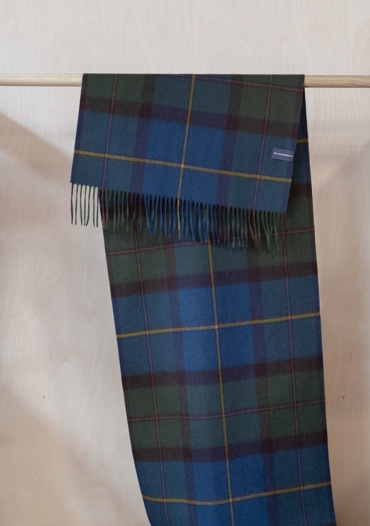 TBCo Lambswool Oversized Scarf in Macleod of Harris Antique Tartan displayed draped with fringed ends, showing blue and green plaid pattern