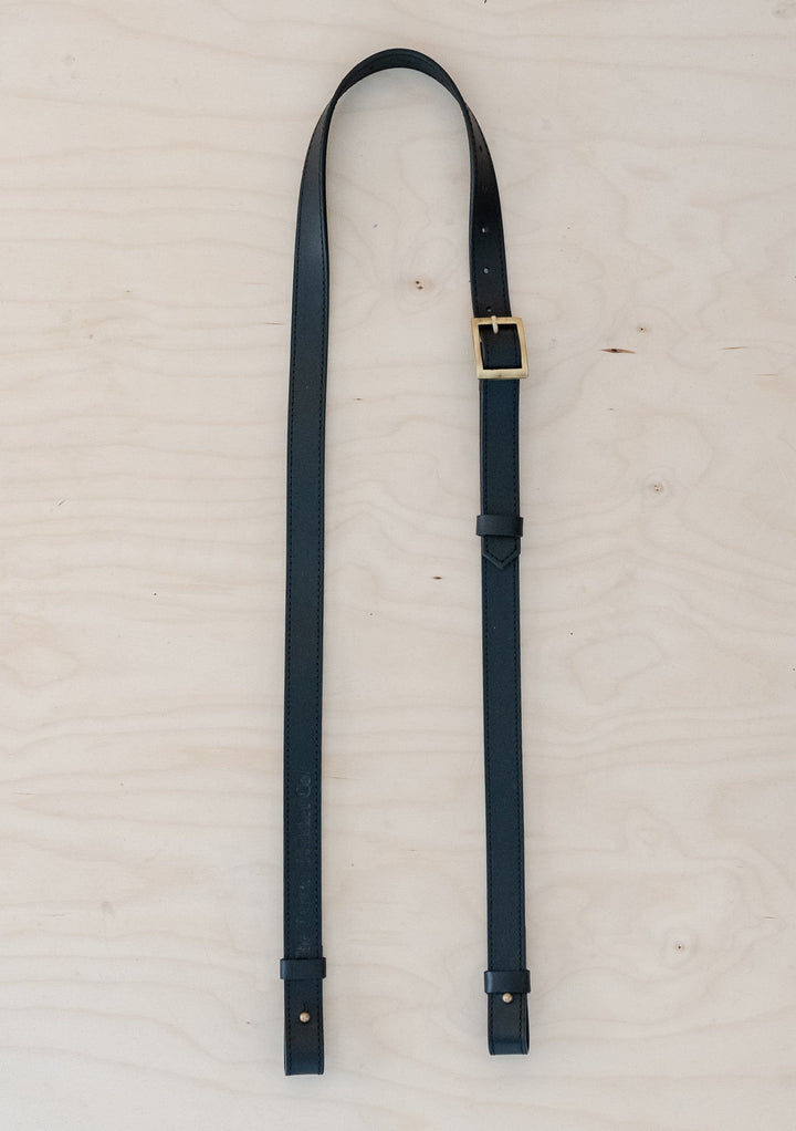 TBCo Leather Long Shoulder Picnic Strap in Black, crafted from high quality materials for effortless carrying of picnic blankets. Featuring an adjustable design and durable construction, perfect for outdoor adventures.