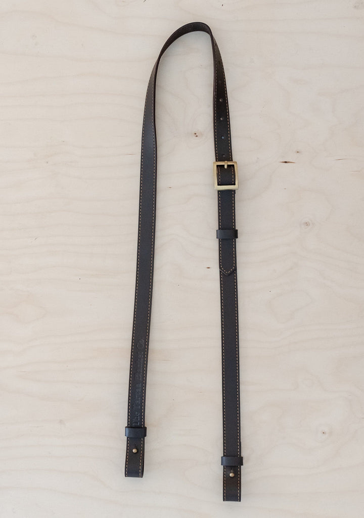 TBCo Leather Long Shoulder Picnic Strap in Brown, crafted from high quality materials for effortless carrying of picnic blankets. Featuring an adjustable design and durable construction, perfect for outdoor adventures.