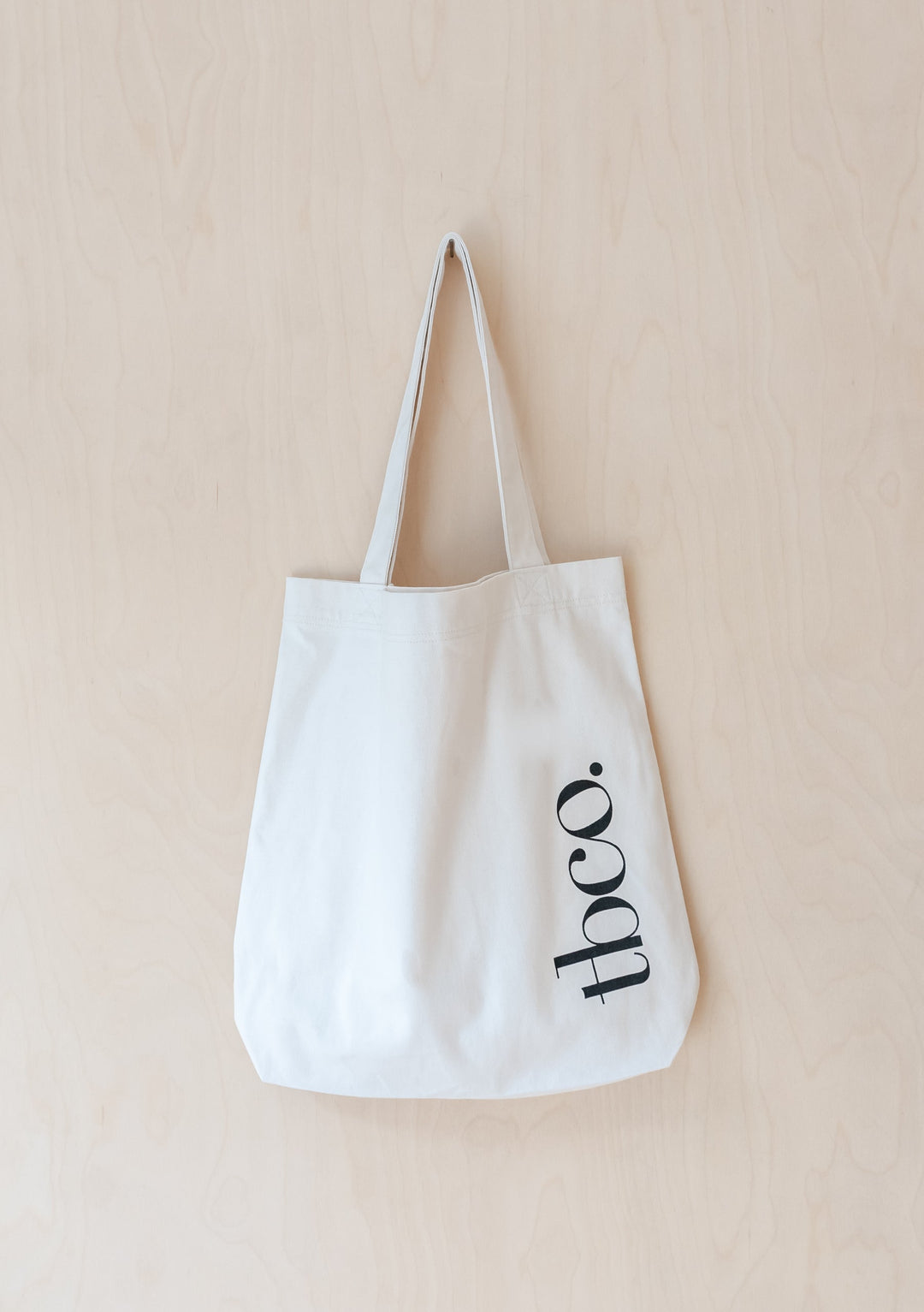 TBCo Recycled Cotton Tote in Ecru with long handles and brand logo, made from durable canvas in off-white colour