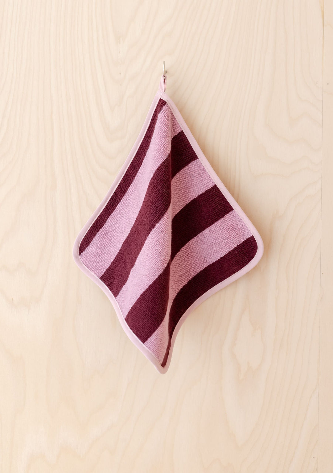 TBCo Terry Cotton Face Cloths Set of 2 in Burgundy Stripe hanging on hook, soft absorbent terry cotton design
