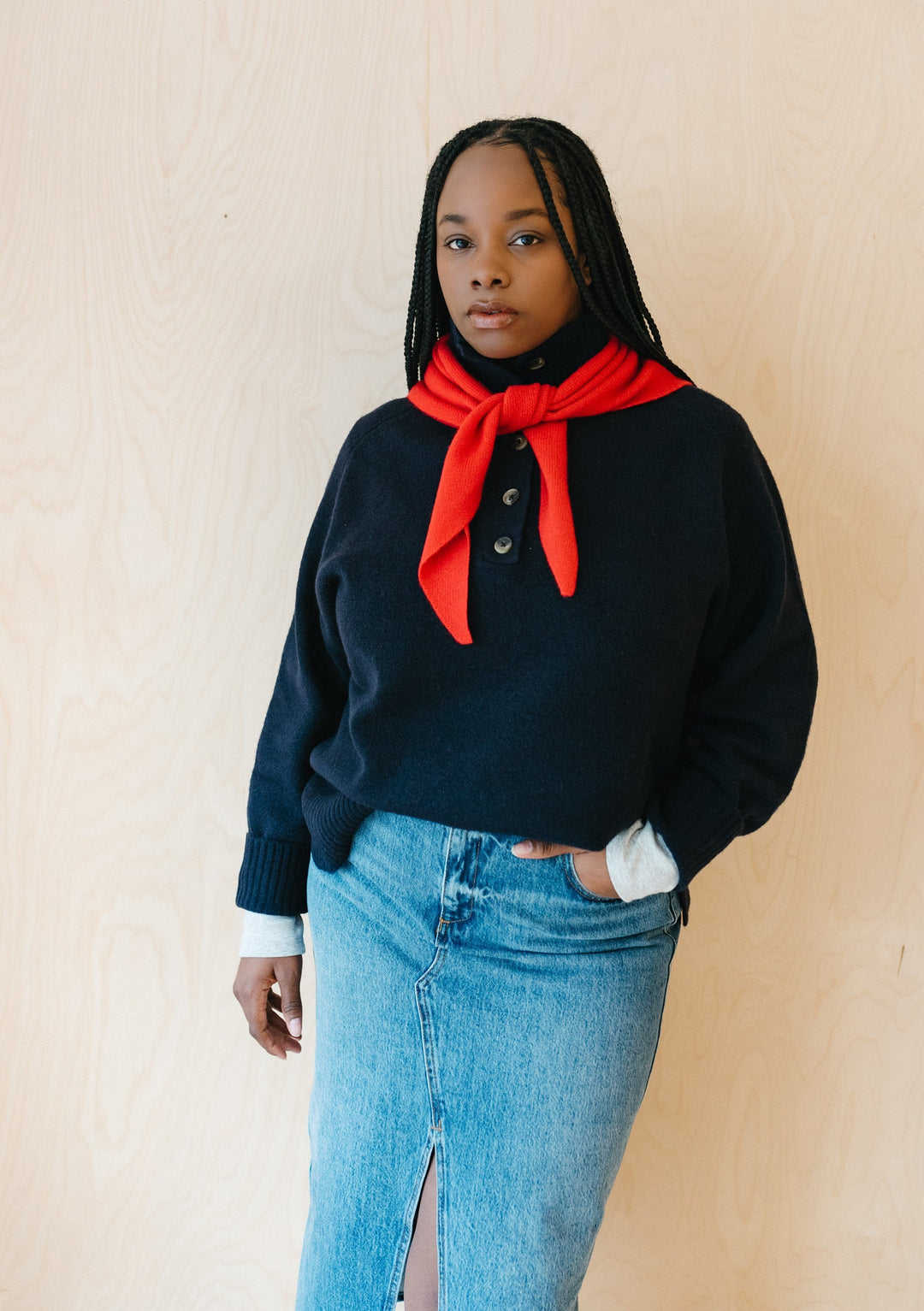 TBCo red merino triangle scarf styled with navy jumper, showing embroidered logo and versatile knotted styling