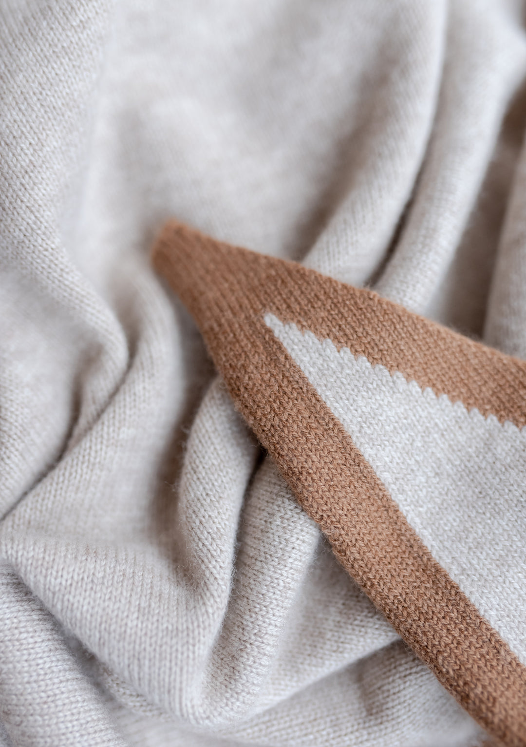 Soft textured Large Merino Triangle Scarf in Oatmeal & Camel with TBCo embroidered logo detail close-up view