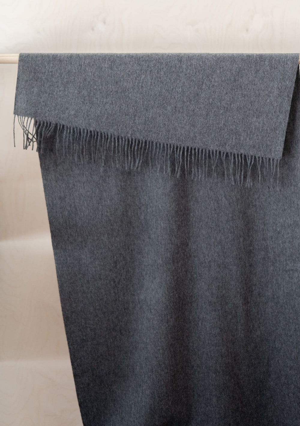 TBCo Cashmere Blanket Scarf in Charcoal Melange draped elegantly showing fringed edge and luxurious texture