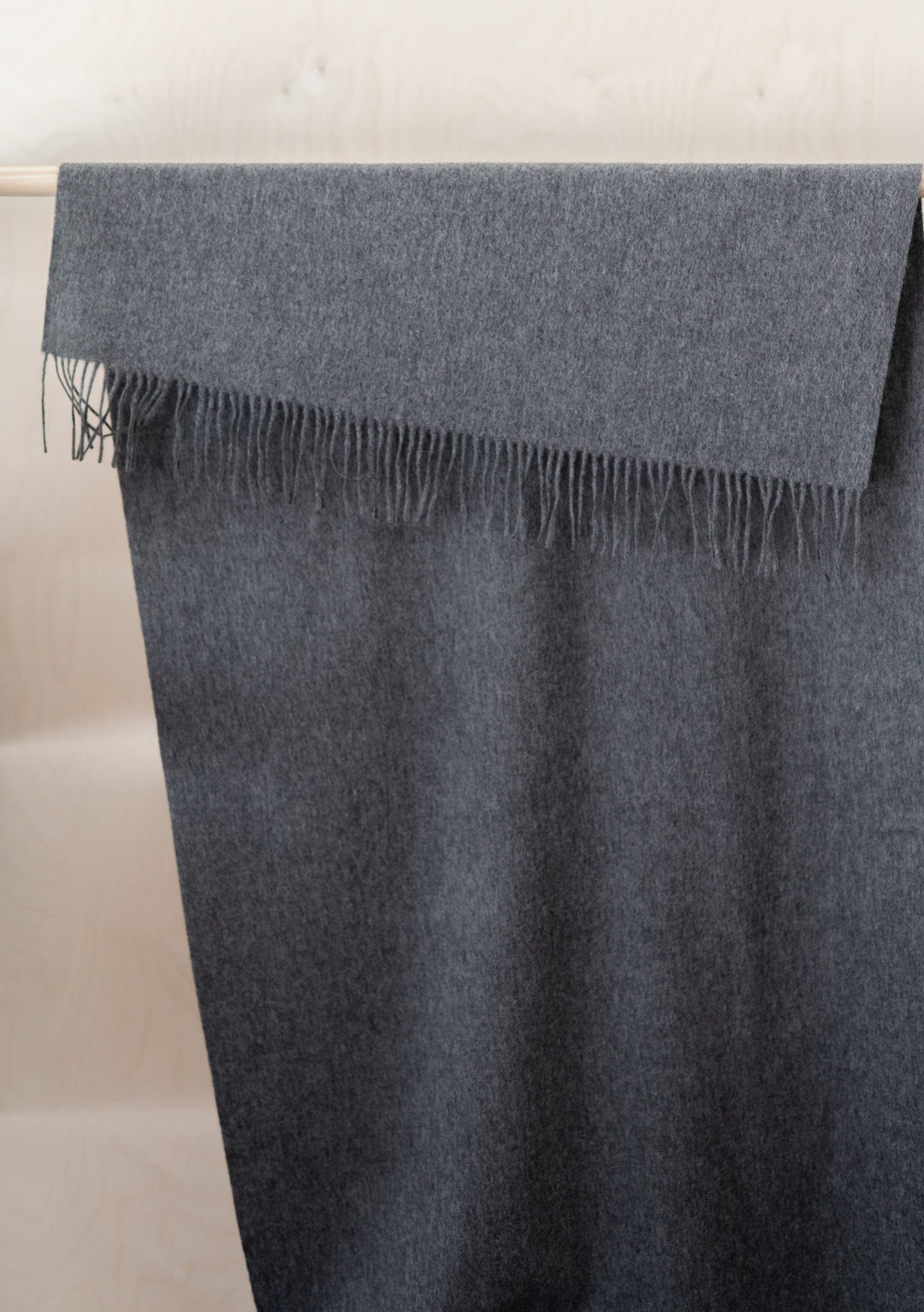 TBCo Cashmere Blanket Scarf in Charcoal Melange draped elegantly showing fringed edge and luxurious texture