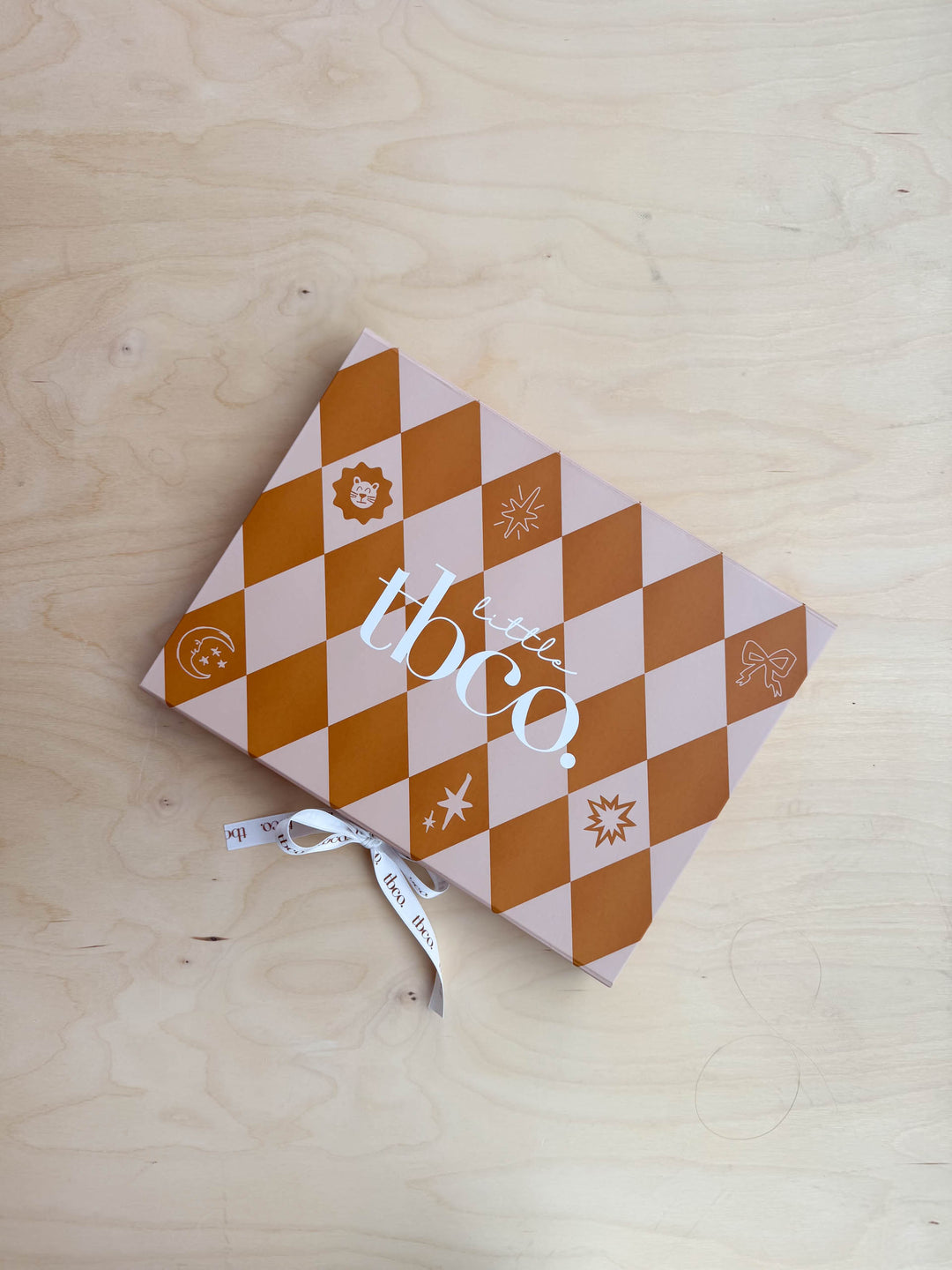 Kids Gift Box by TBCo in portrait, gallery position 3, with orange diamond pattern on wooden background