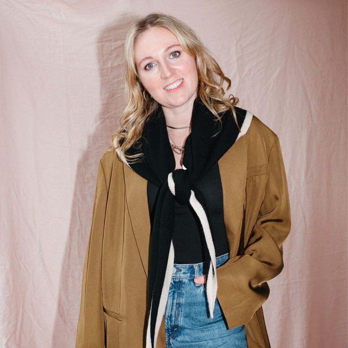 Meet Emma. TBCo Co-founder and CEO Emma MacDonald wearing a Large Black and Cream Merino Wool Triangle Scarf.