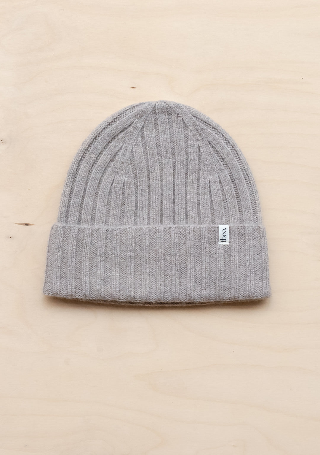 TBCo Cashmere & Merino Beanie in Oatmeal Melange with ribbed texture, folded brim and signature TBCo label