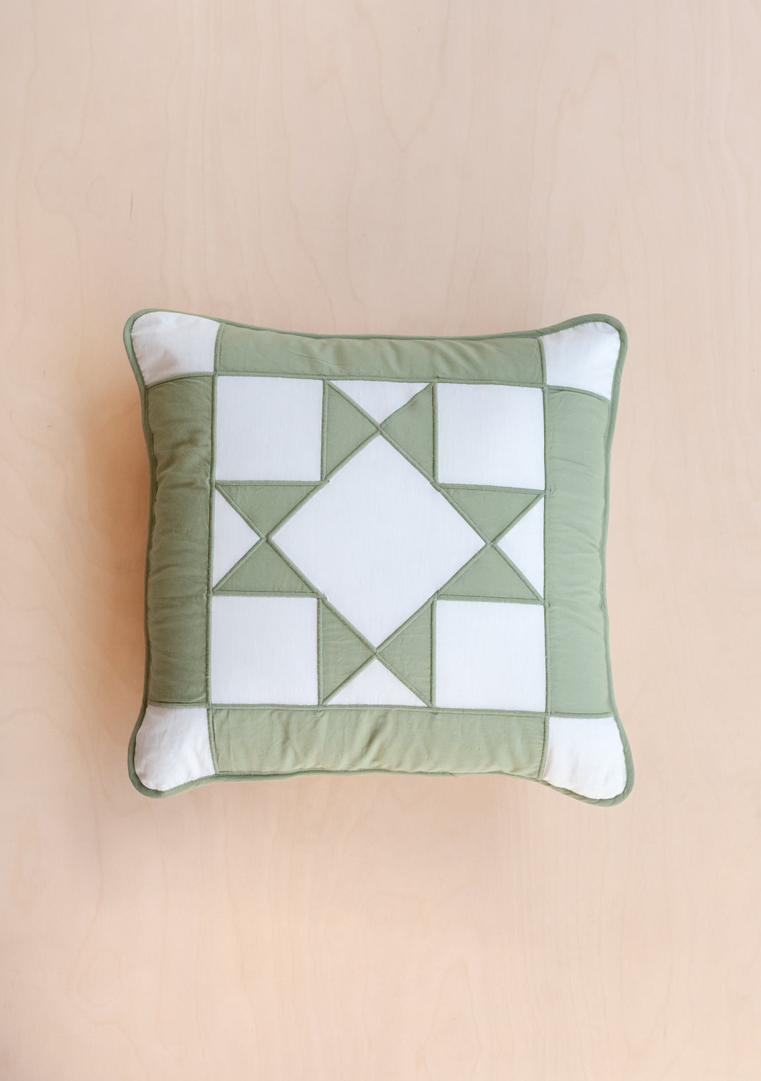 TBCo Quilted Cushion Cover featuring a reversible celestial checkerboard pattern in sage green and white with geometric star design